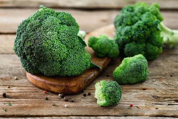 how to plant stir fry broccoli | Family Cuisine 2 fresh organic broccoli on wooden table close up 6WDXX89